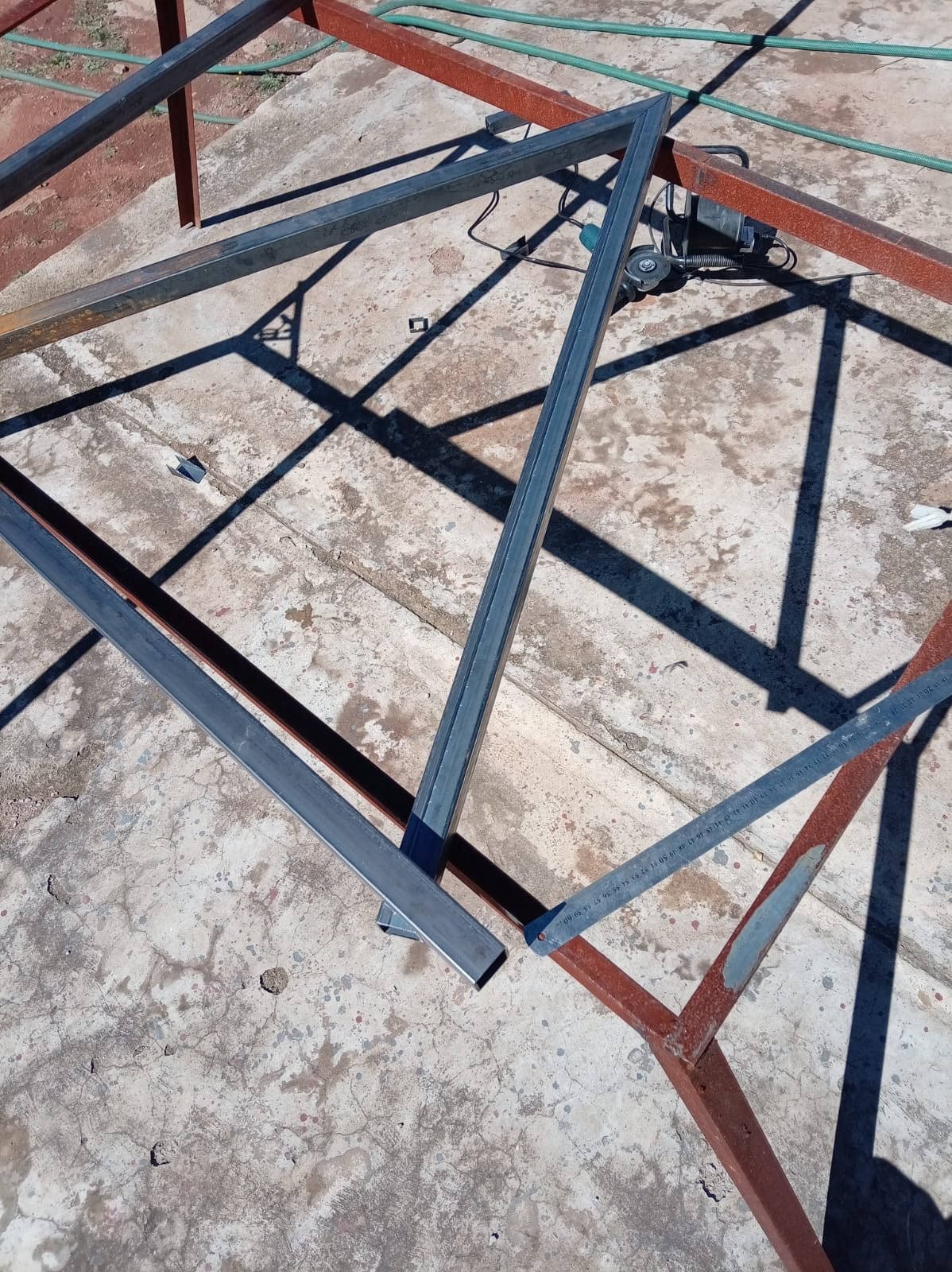 Steel frame being squared and measured